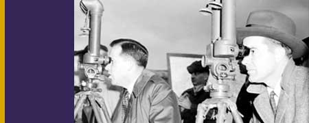 Senator Henry M. Jackson and Congressman Ed Edmundson looking through observation periscopes